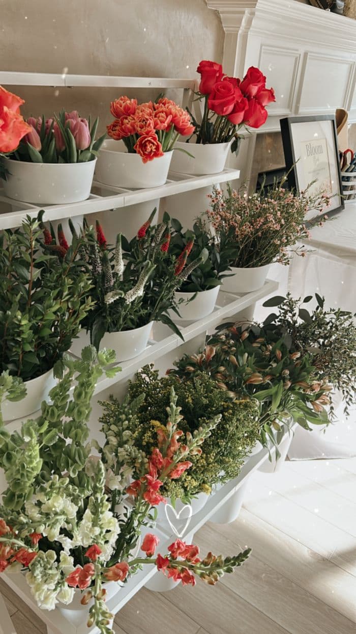 Tiered flower display with curated seasonal blooms
