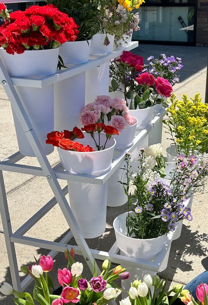 Outdoor bloom bar setup at community event