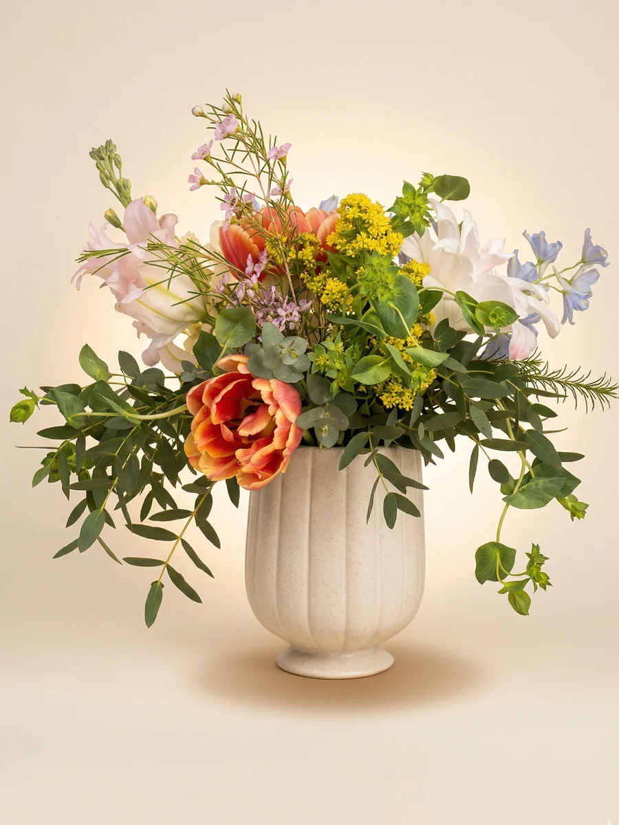 The Savannah - lush petite arrangement with coral parrot tulips, pink lilies, and blue delphinium